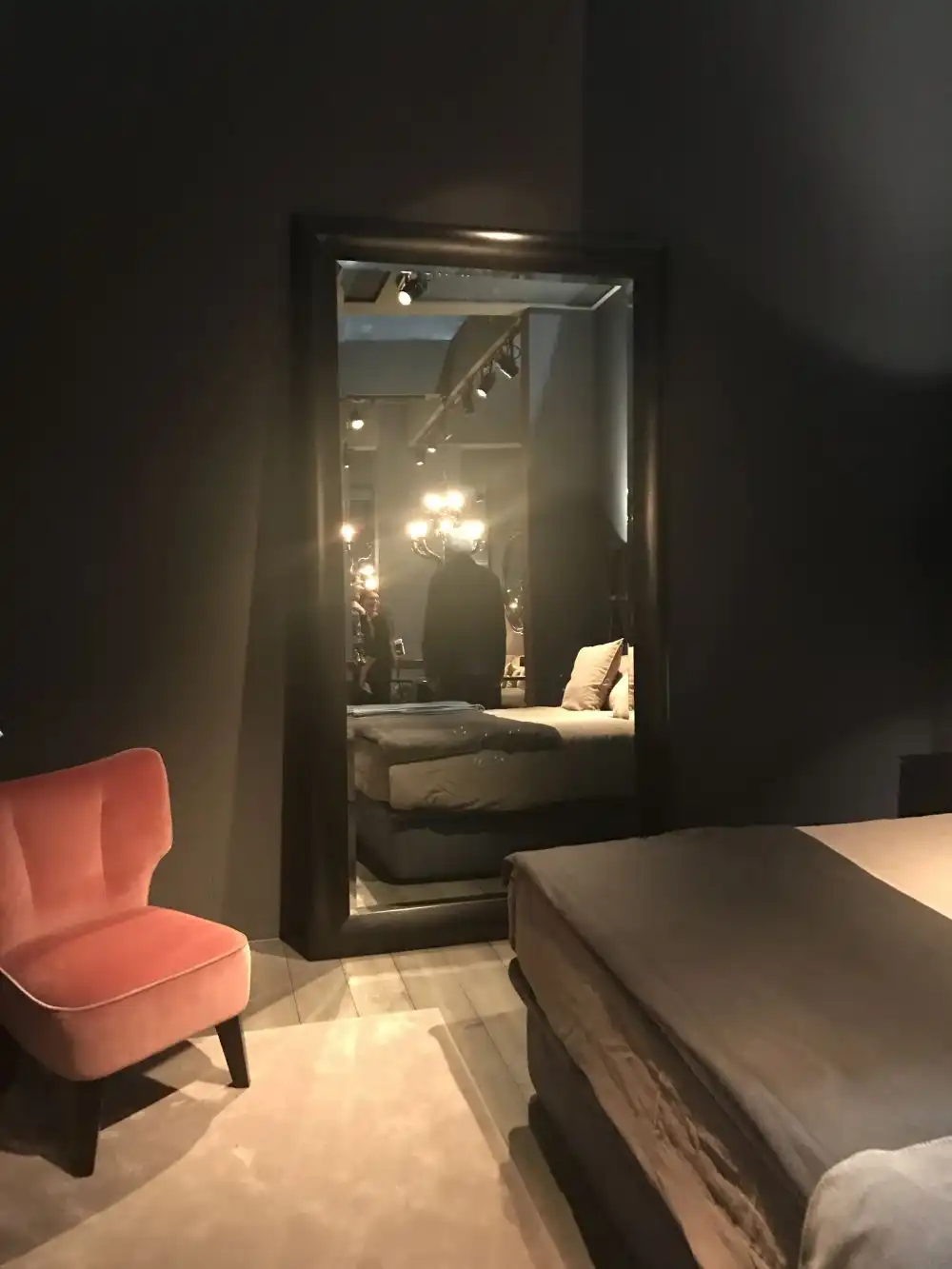 Master bedroom with large decorative mirror