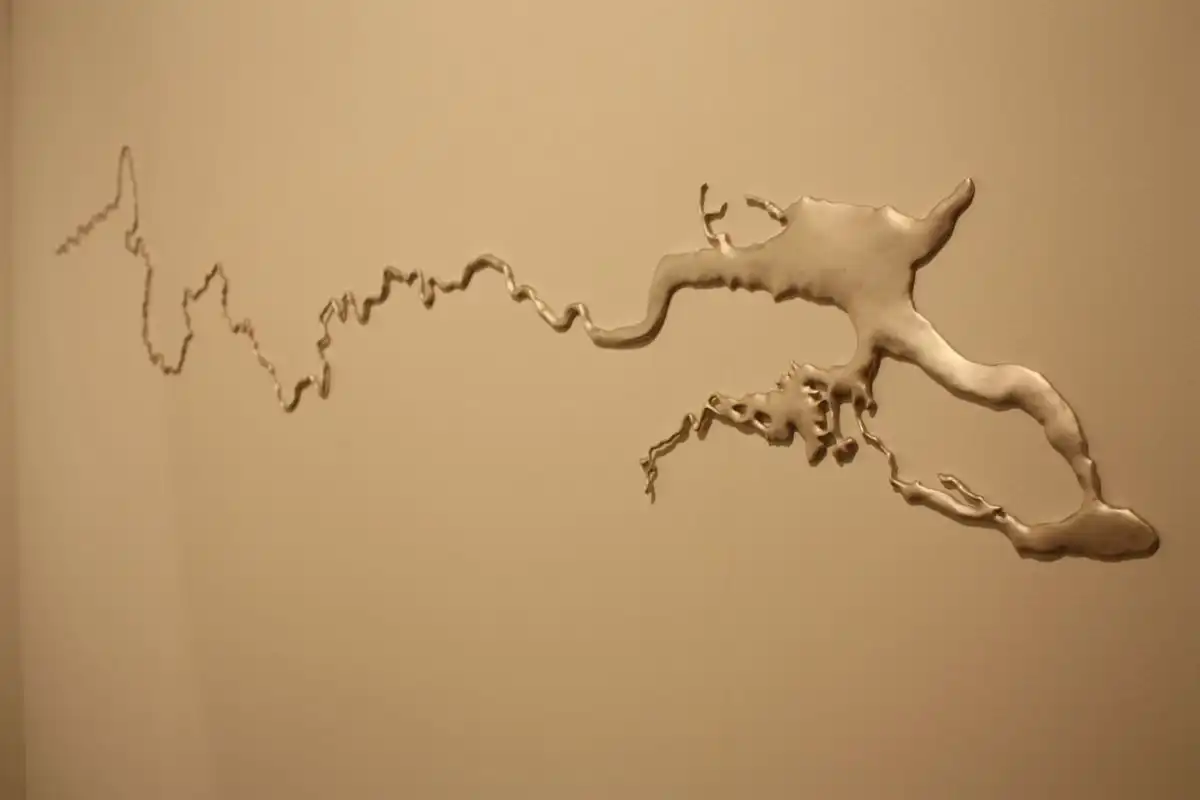 A simple but dramatic work, like this one made from recycled silver by Maya Lin, also makes a statement, albeit a subtle one. Perhaps in your updated serene living room?