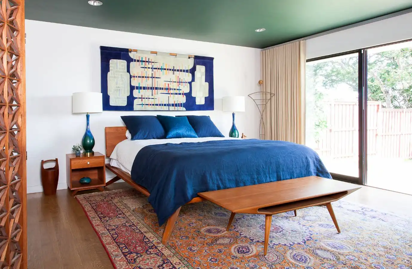 Mid century bedroom with a small bench