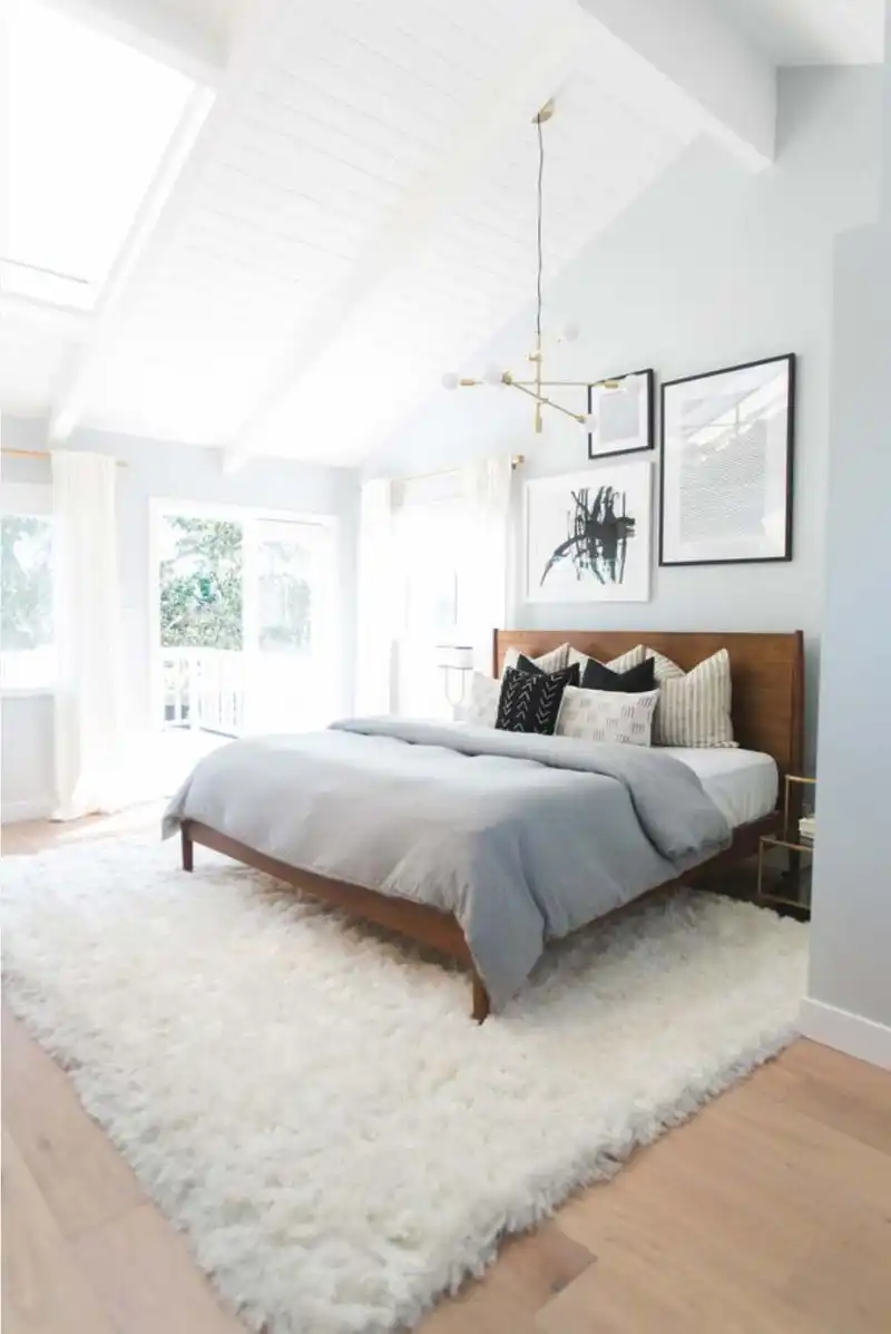 Mid century bedroom with brass chandelier