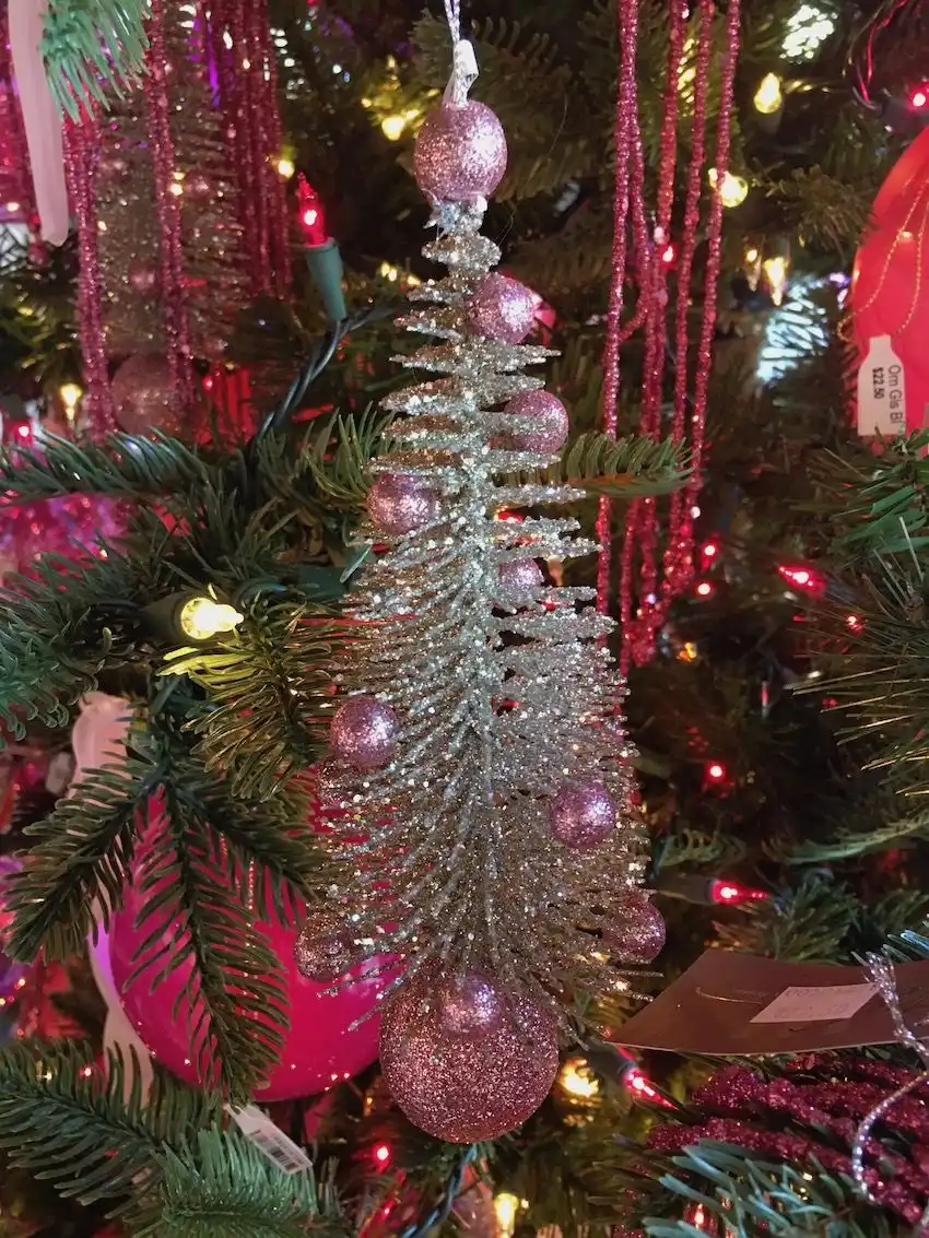 Mini glittery tree ornaments echo the overall color scheme and are amazingly cute!