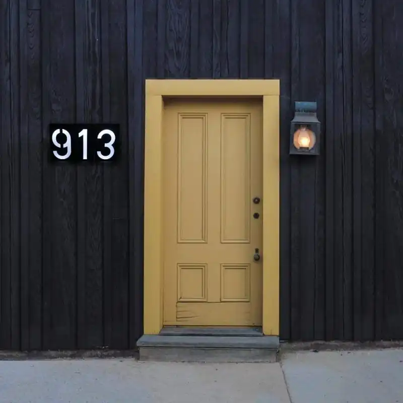 Minimalist house number plaque with waterproof frame