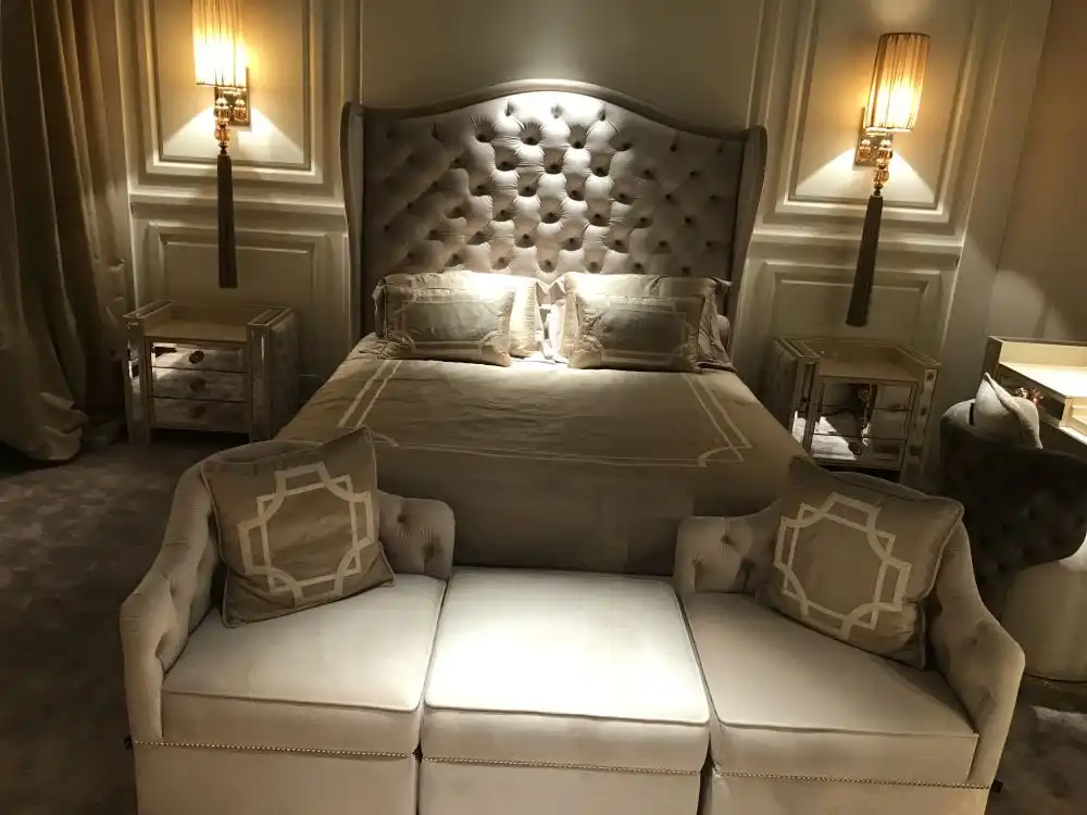 Mirrored table nights and upholsted bed headboard