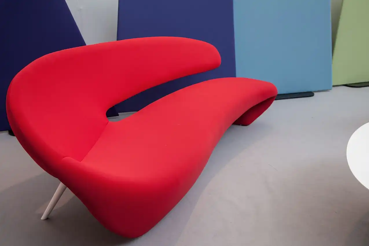 The sensuous curves of the design are a soft counterpoint to the table and other modern elements.