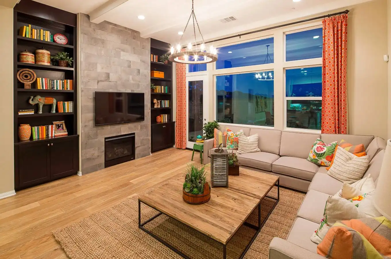 Modern living room with wooden coffee table and coral curtains