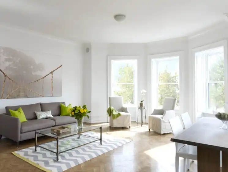 Modern white living room with bay windows