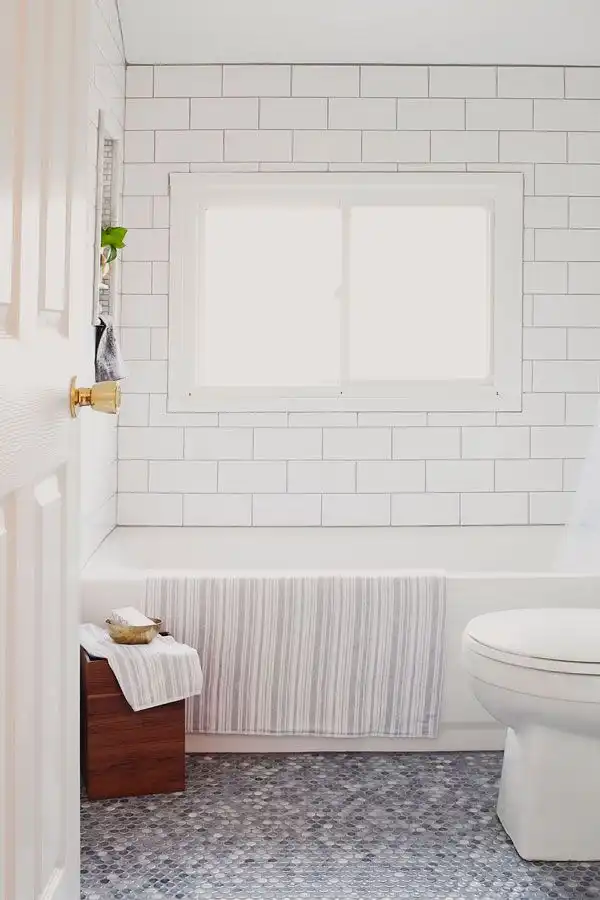 Mosaic bathroom floor from penny tiles