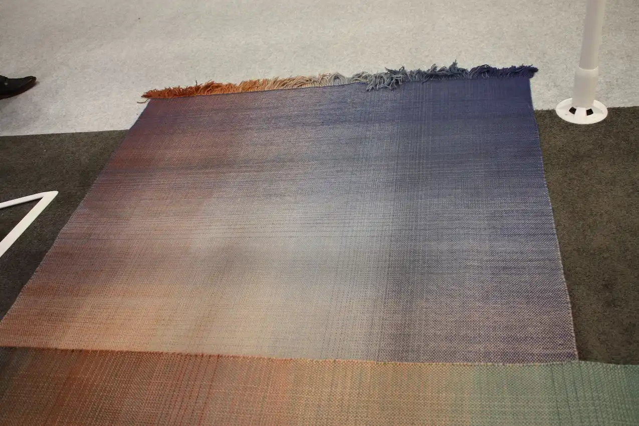 The simple appearance belies the complex weaving that creates the color gradients.