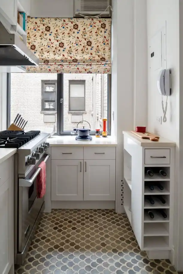 Small kitchen with large windows and cute shades