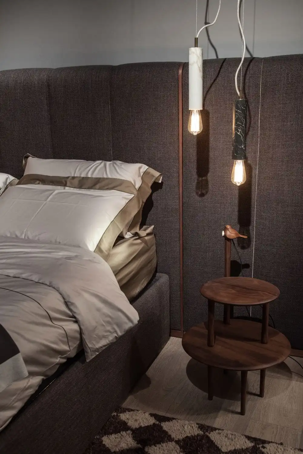 Nesting tables and hanging lamps over them used like bedside tables