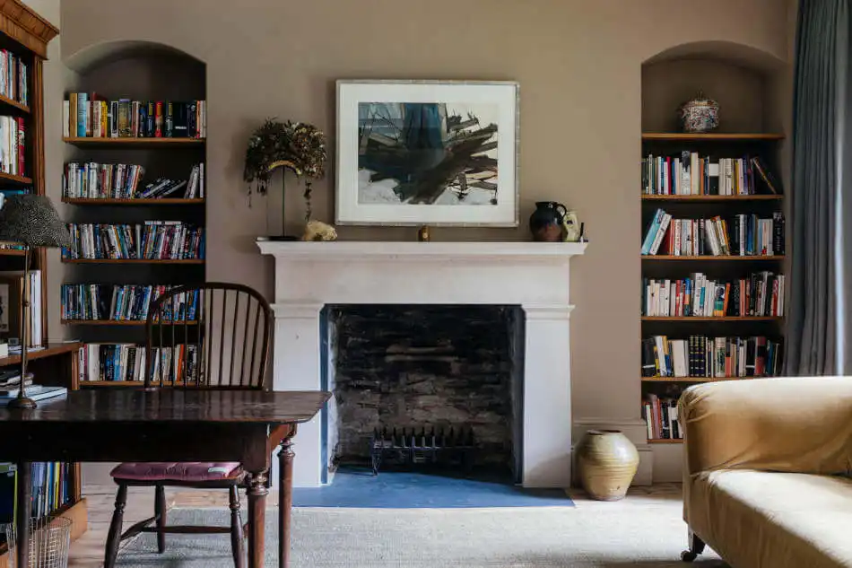 Office Room with fireplace and bookshelf