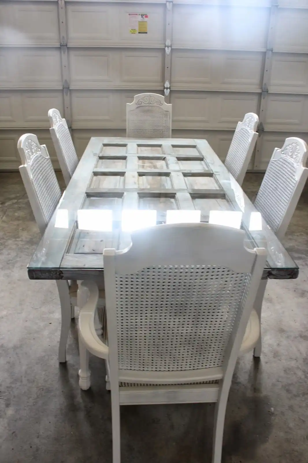 Old door turned into a dining table with glass top