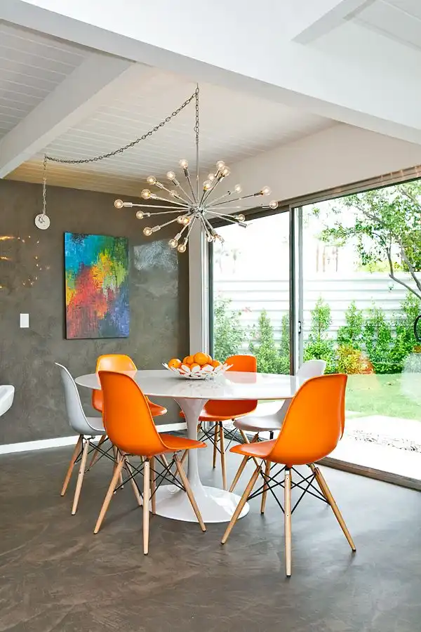 Orange Eames Chairs With Tulip Table