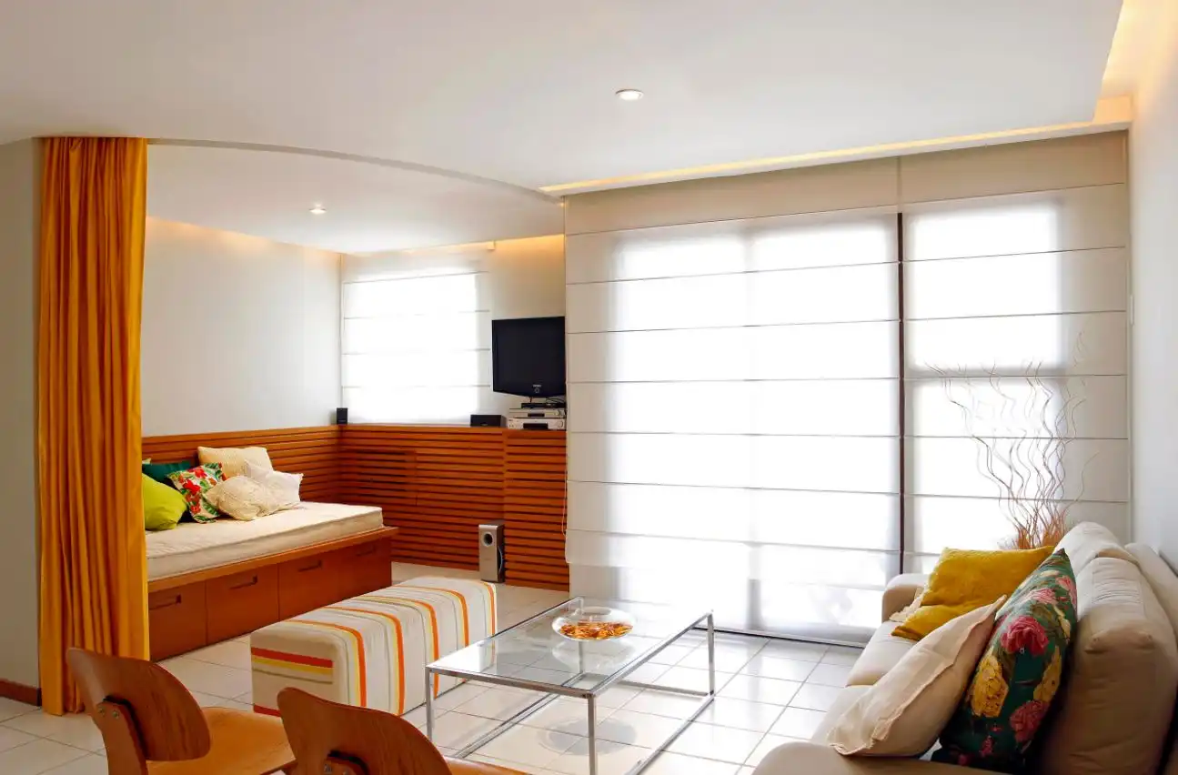 Orange curtain used like a room divider