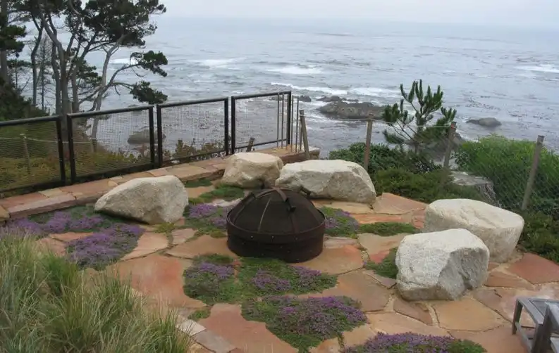 For a more organic and natural look, decorate the patio with large stones and patches of moss