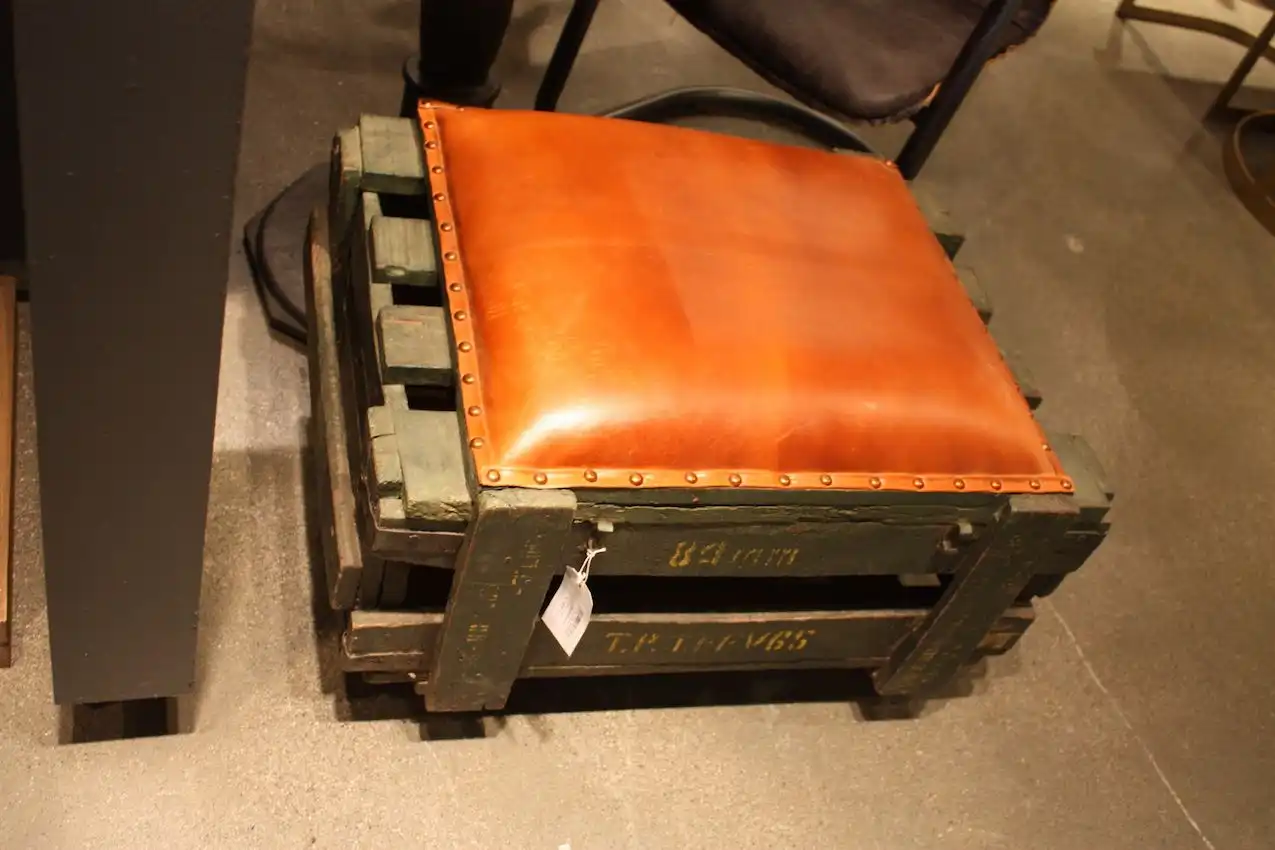 This style can incorporate upholstery as long as it is on the masculine side.