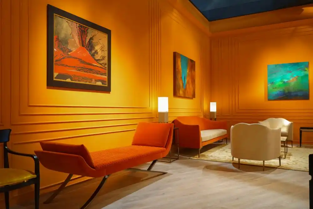 Painting the walls in orange shade and using same color for furniture