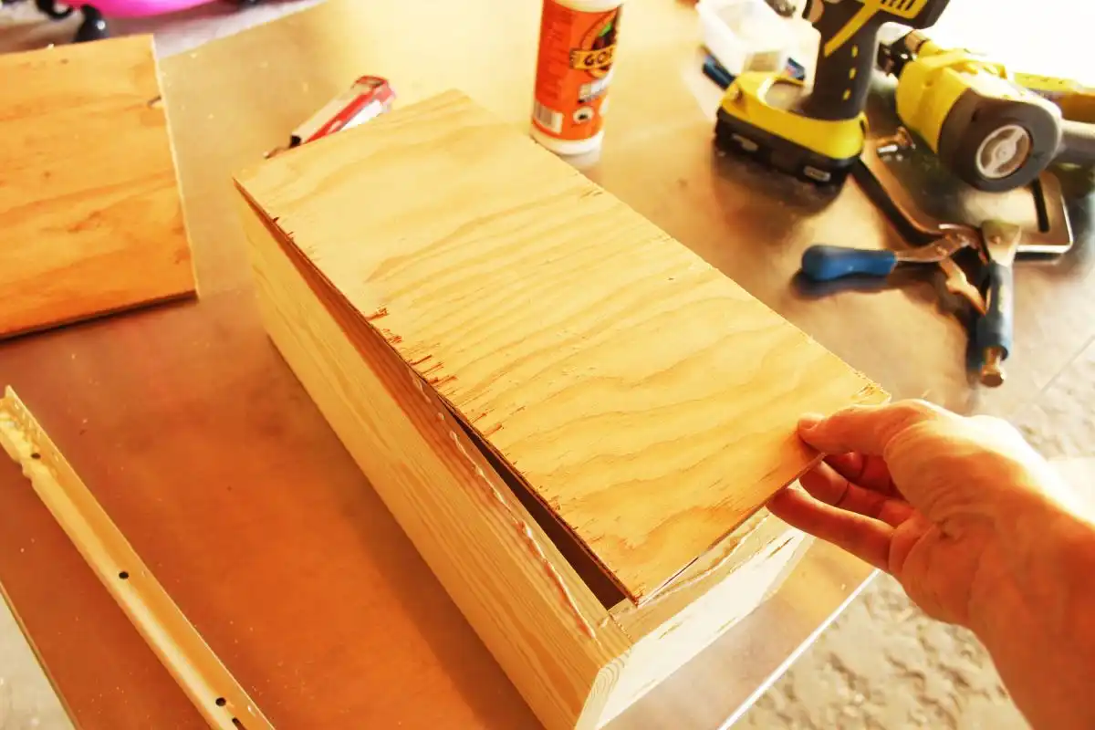 Place the drawer bottom on the glue
