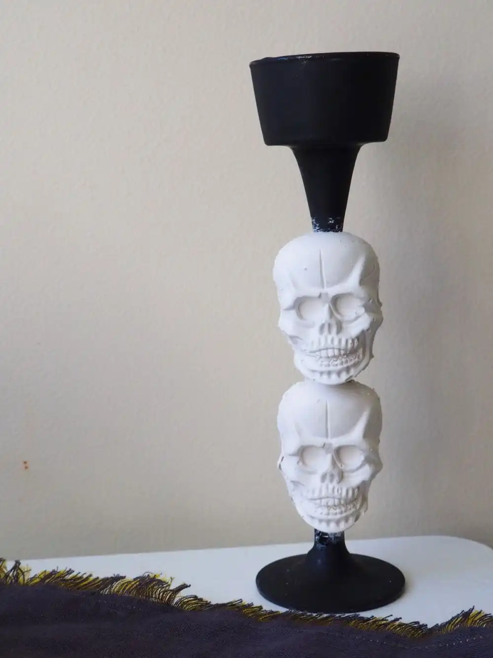 Plaster skull candlsestick