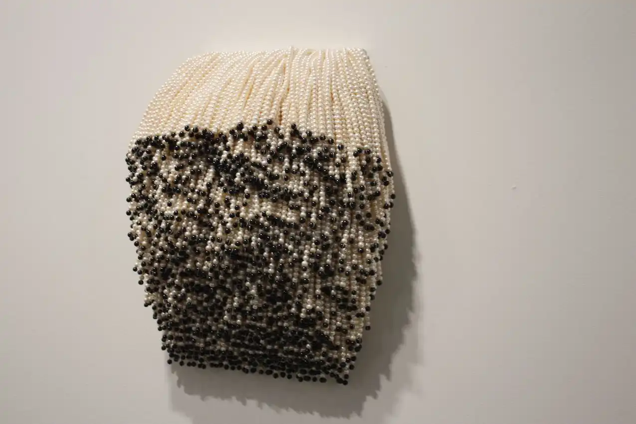 The piece consists of plastic beads.