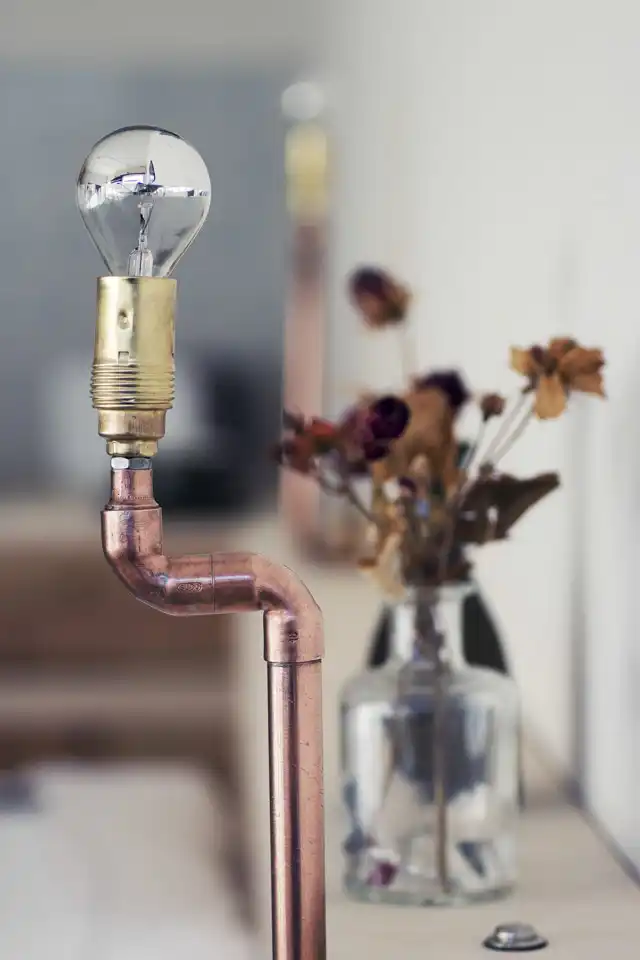 Plus One Small Apartment in Berlin Copper Lighting Fixture