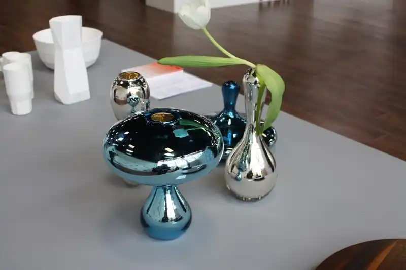 Brooklyn is home to the well-known Pratt Art Institute, so it's perfectly natural to see a display of student work at the fair. Pieces ranged from wooden pieces to accessories like these mirrored glass vases.