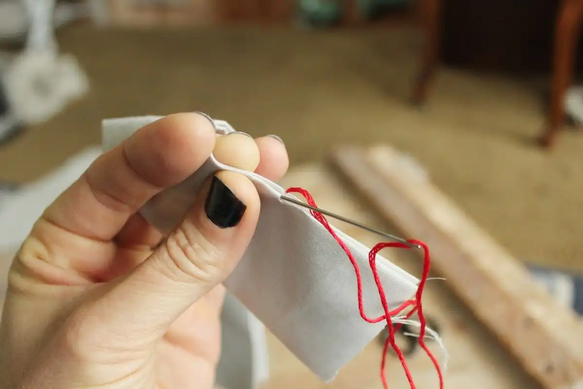 Press the tip of your needle on the opposite