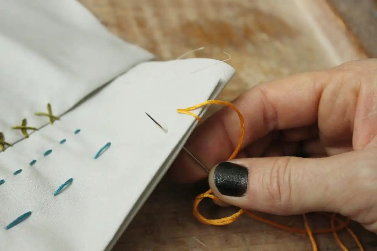 Press the tip of your needle on the underside