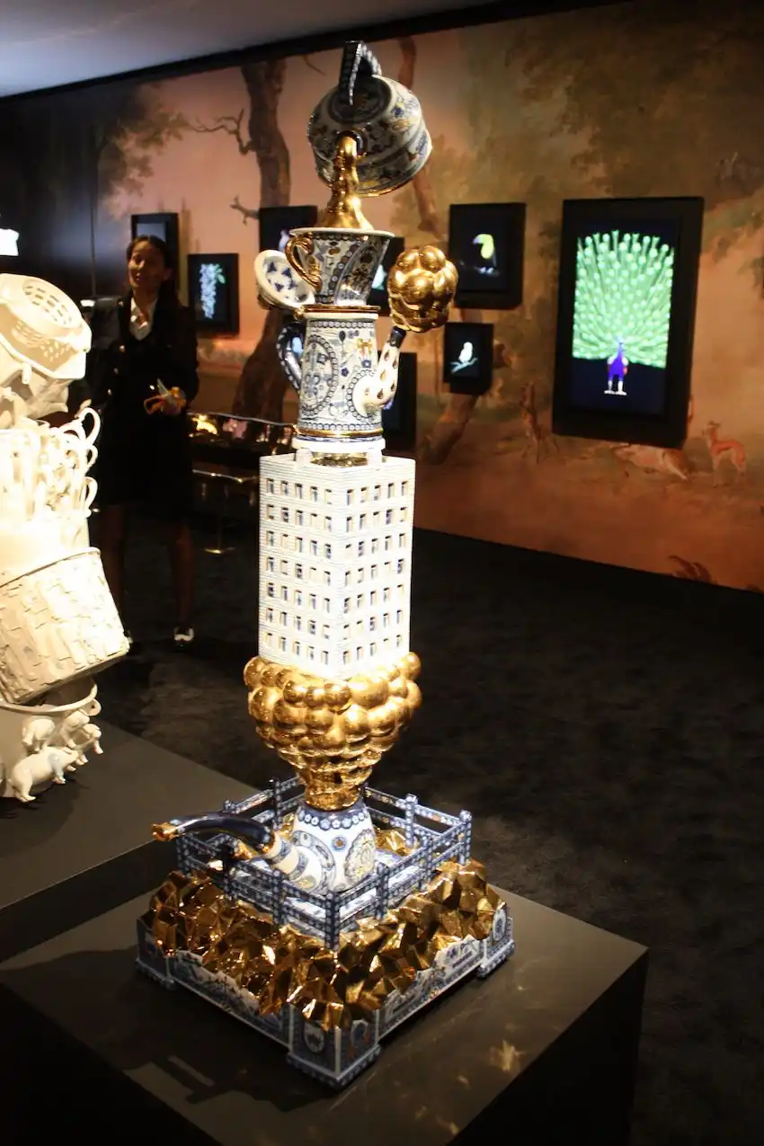 Whimsical elements and gold leaf make this an initial teapot tower.