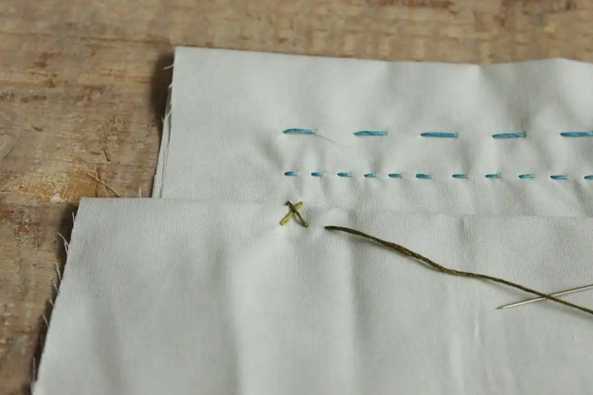Pull the whole needle and thread through