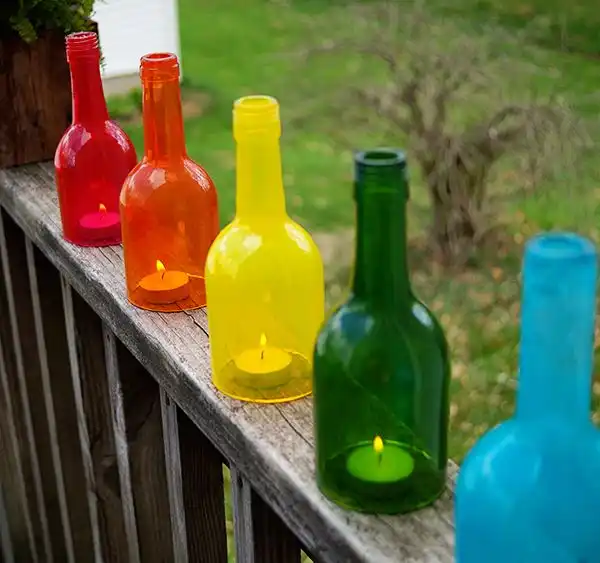 Rainbow lanterns using candles and wine bottles