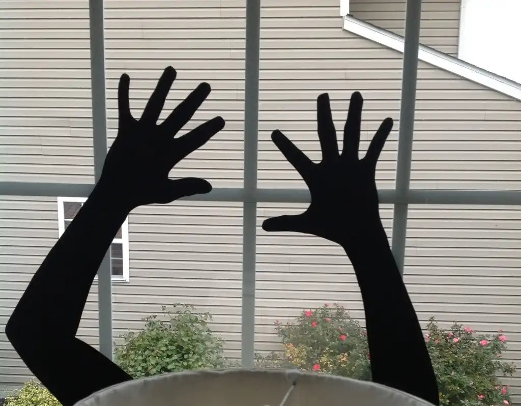 Reaching Hands Window Silhouette