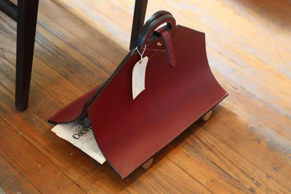 Red leather magazine rack