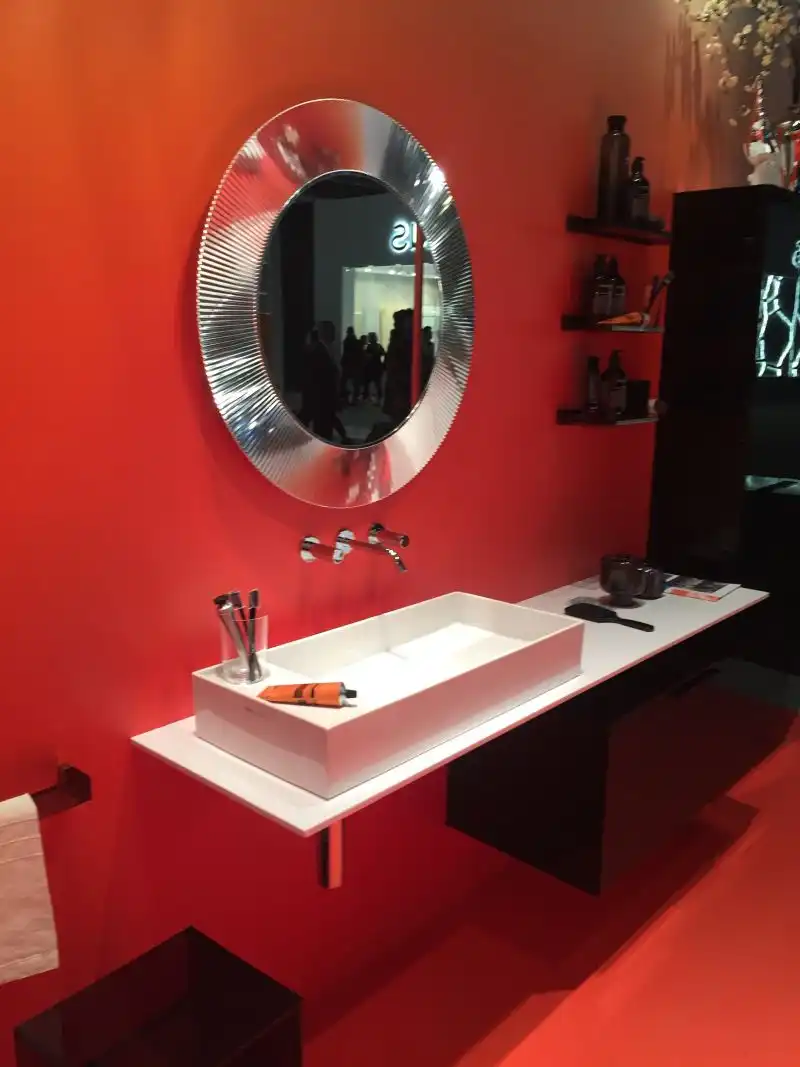 Red wall for bathroom with a cool mirror