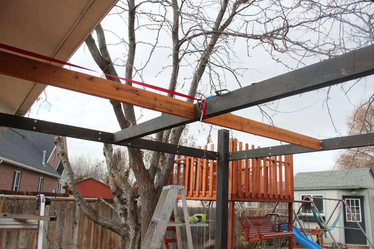 How to Install Modern Pergola Rafters Without Brackets - ratcheting strap