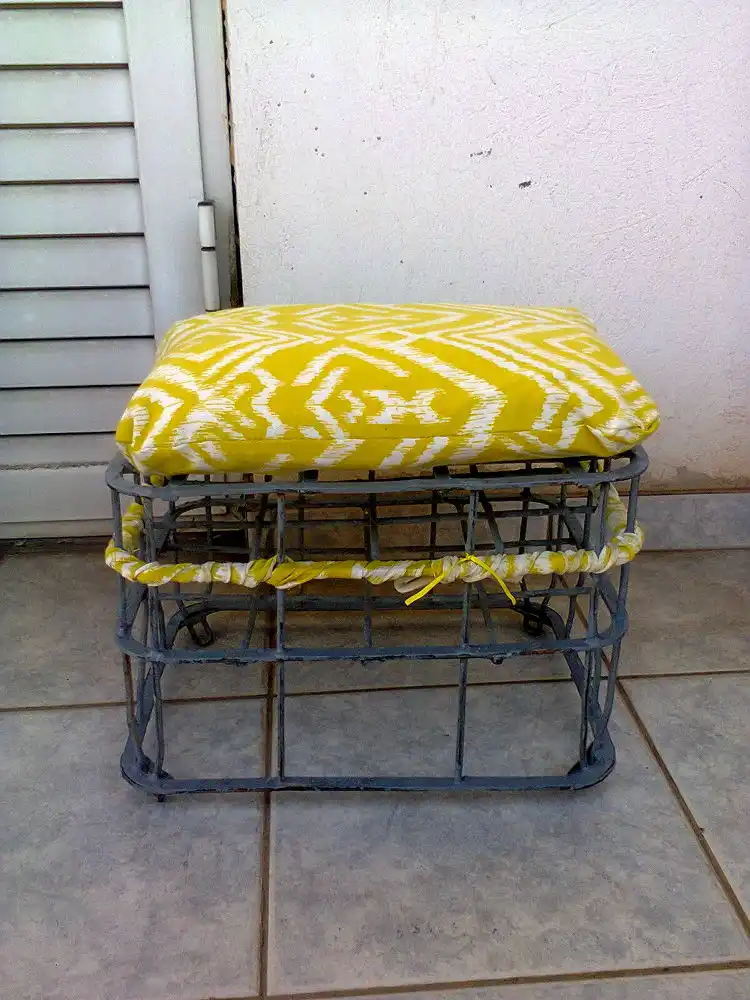 Repurposed milk crate into a stool