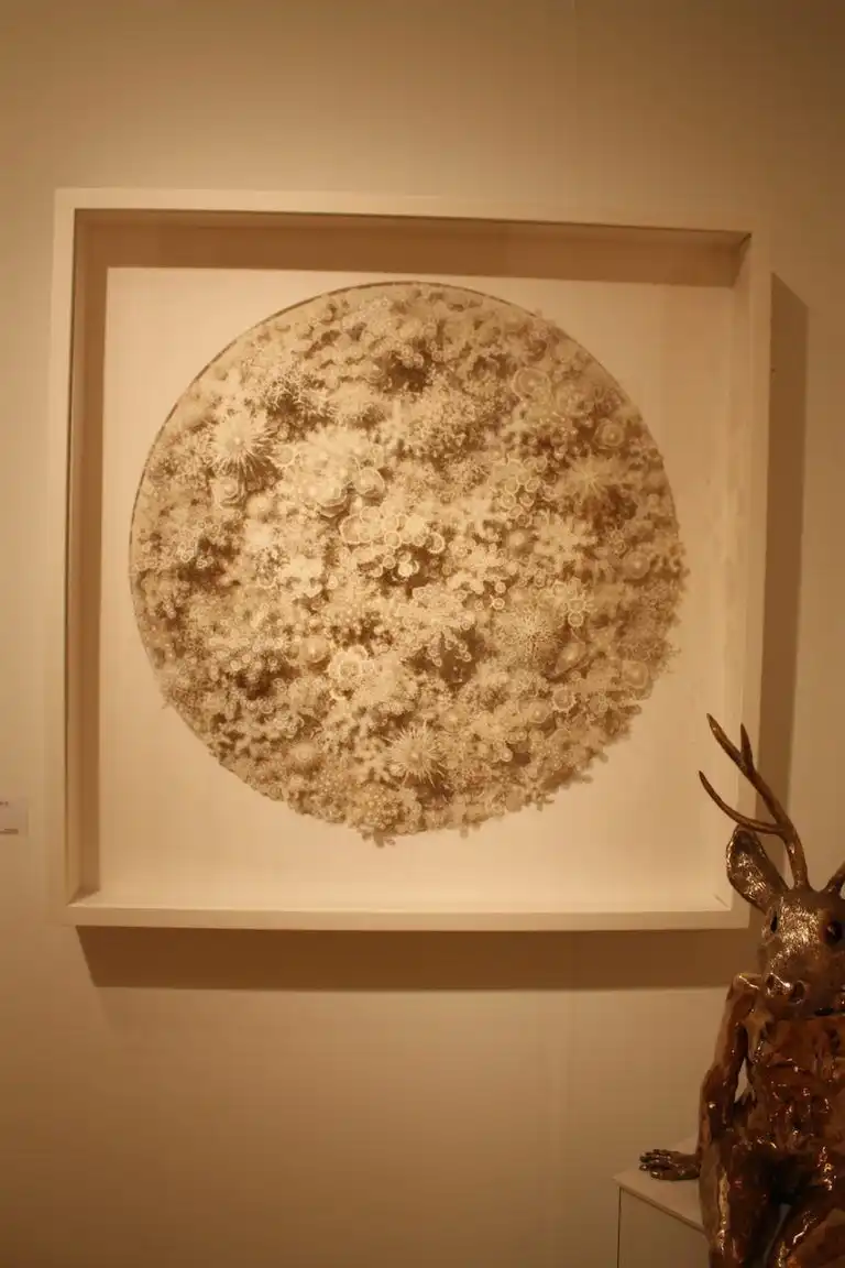 The layering of the cut paper adds amazing depth to the pieces.