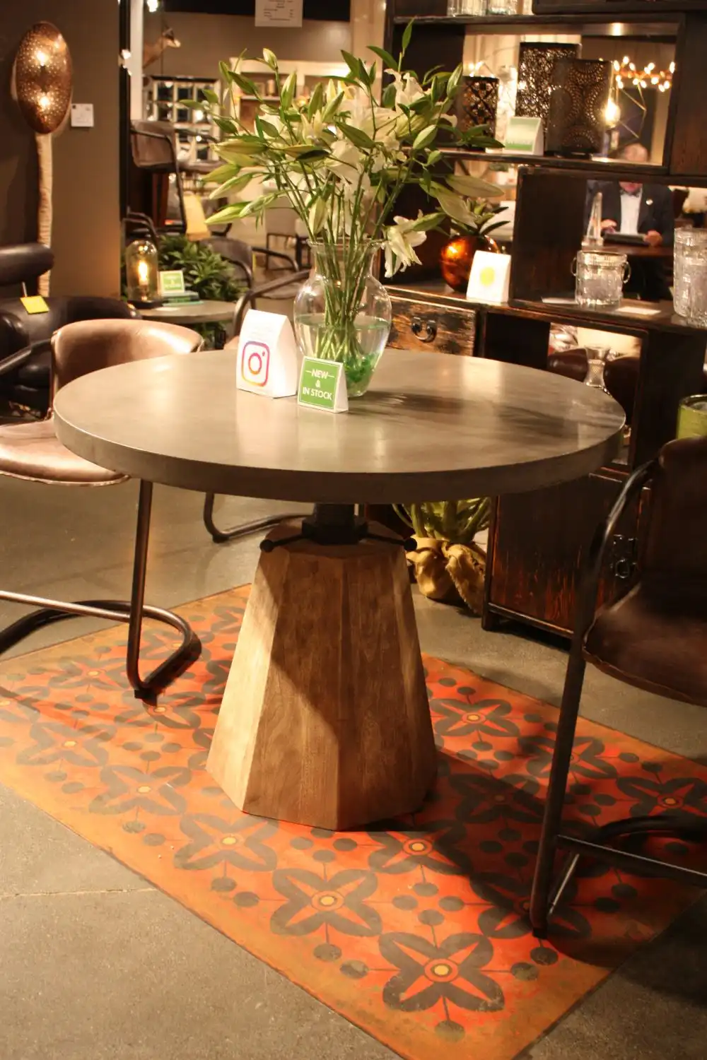 Round dining table with glass flower bowl on the middle