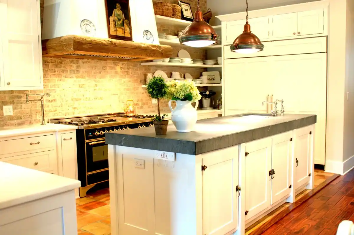 Rustic copper pendant lamps over the kitchen island