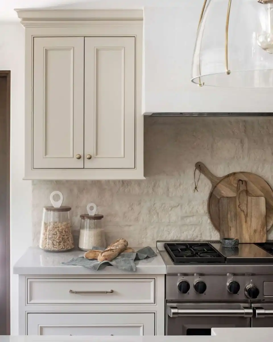 Rustic stone backsplash with German schmear