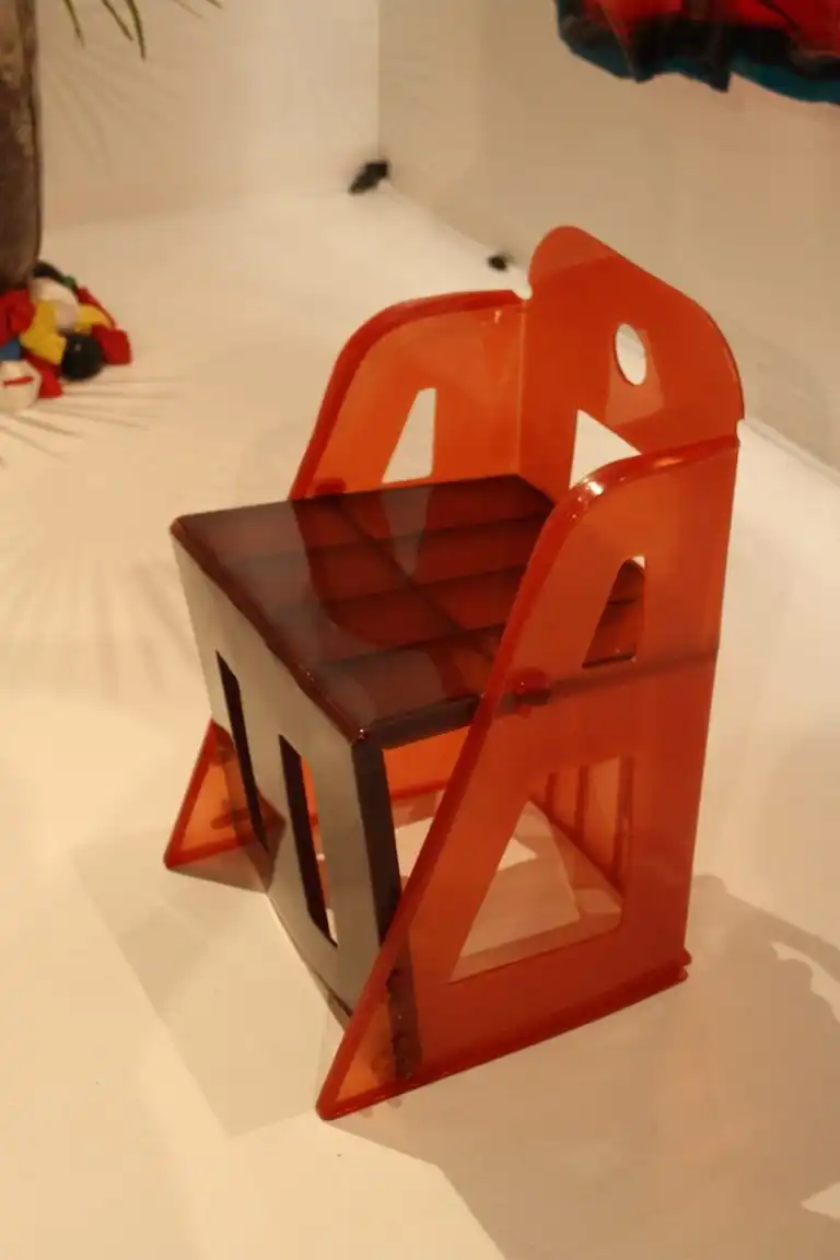 Two colors of acrylic accent the angular shape of the seat.