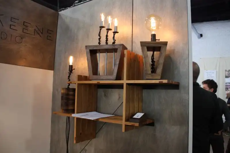 This gorgeous collection is from Sam Keene. The woodworker created the shelving as well as the light fixtures, which are part of the "Bits" collection. Keene uses industrial drill bits in the design of these warm, vintage feeling light fixtures.
