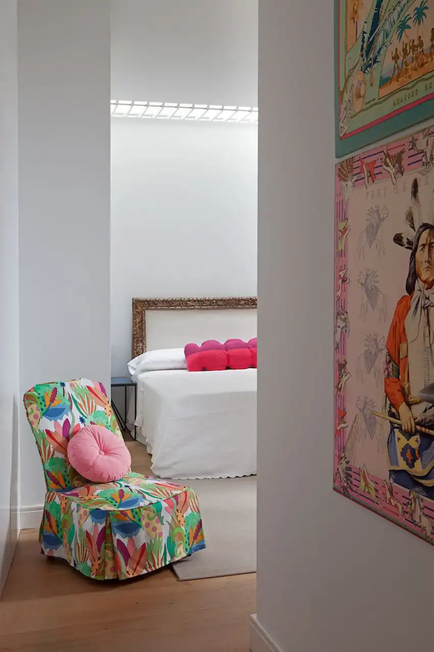 A multicolored slipper chair adds more punch to the room as you enter.