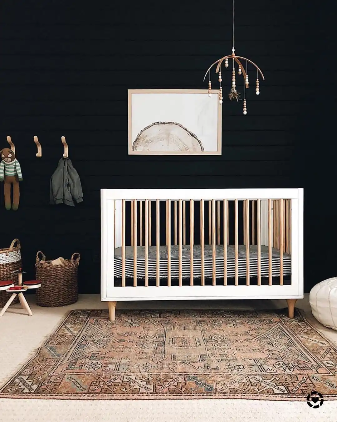 Scandinavian nursery decor with black wall