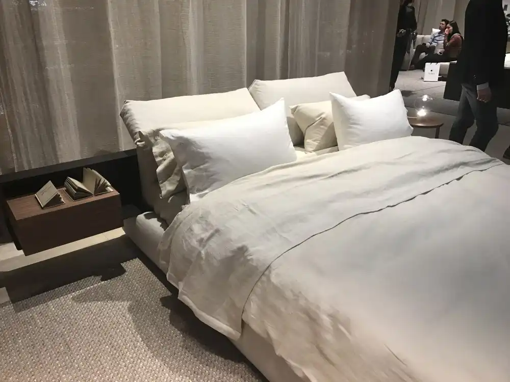 Curtains, area rugs as well as cushions and blankets can really make a modern bedroom look cozy