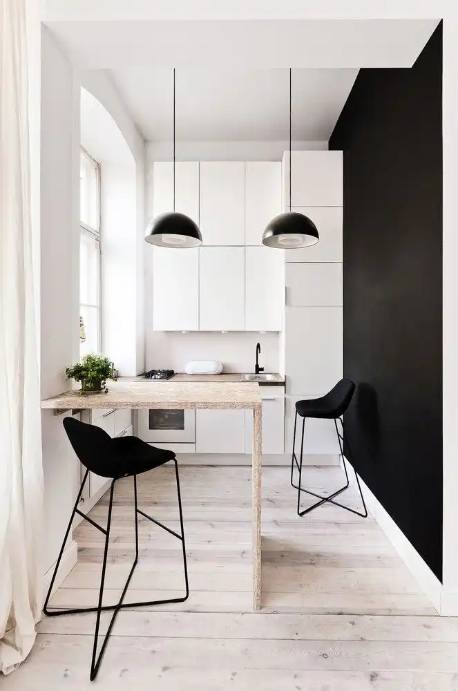 A stylish small black and white kitchen combo design