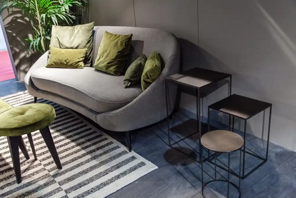 A small sofa or daybed can be a good replacement for the chair