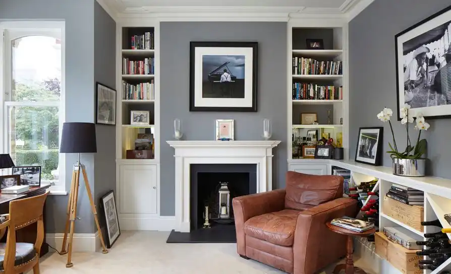 Small living room with tripod floor lamps