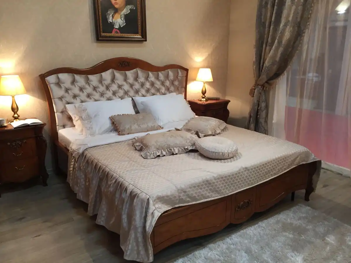 Solid wood bed with tufted satin headboard