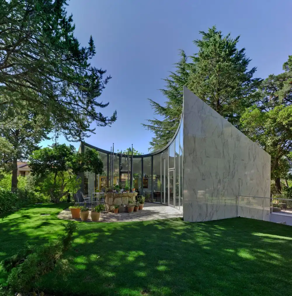 The overall architecture and shape of the house give it a futuristic appearance